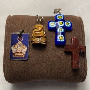Set of miscellaneous religious necklace charms.
